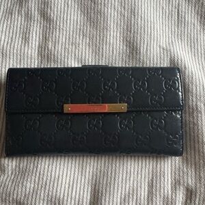 Gucci Black Embossed Leather Wallet with Gold Accent